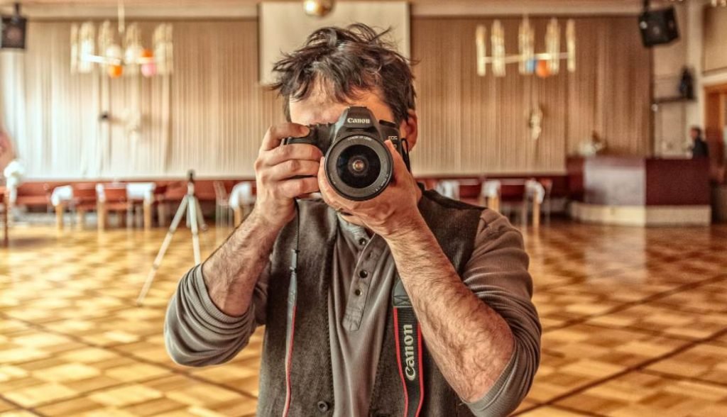 Image of a photographer holding camera