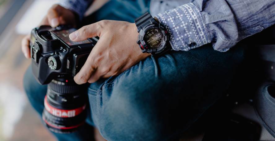 image of a man holding a camera