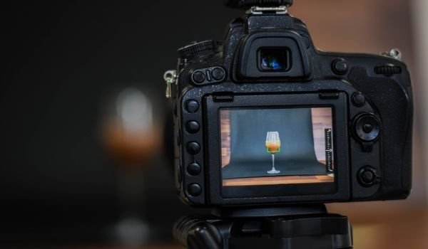 Image of camera taking a photo of juice glass