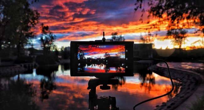 Image of a phone taking sunset photographs