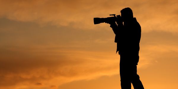 photographer taking sunset pictures