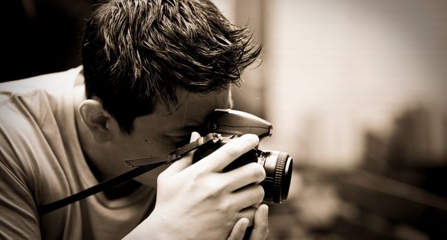 a guy taking pictures with dslr