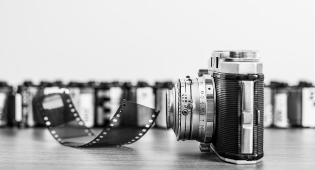 black and white image of a film camera