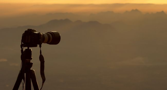 image of a camera on tripod at the mountain