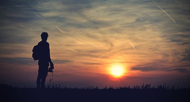 image of a guy looking at sun