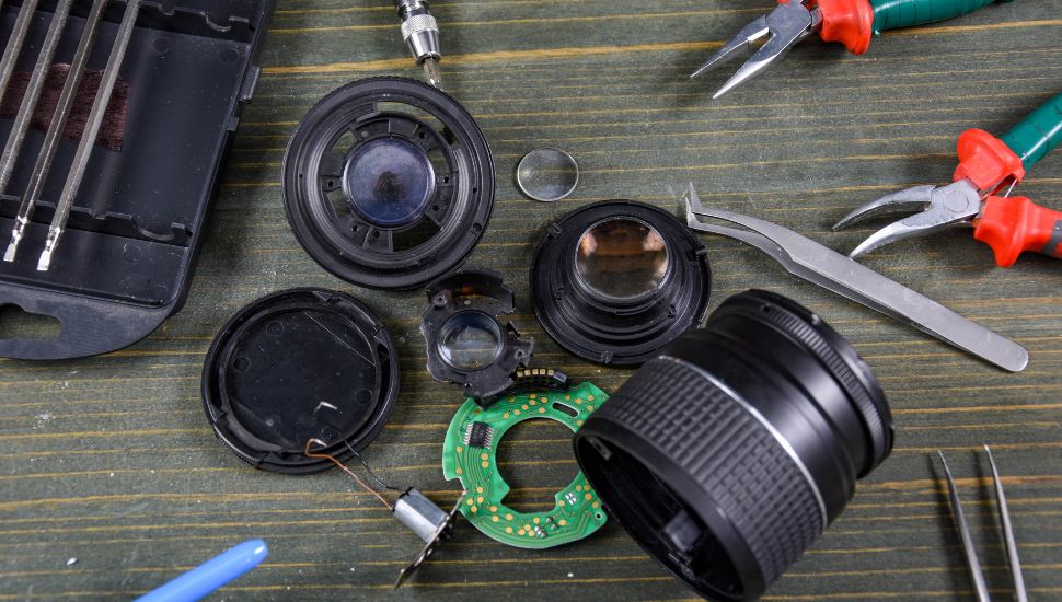 camera lens a bunch of tools for repair