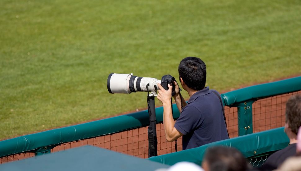photographer taking pictures of a baseball game