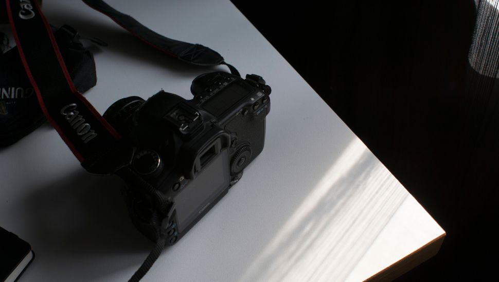 image of a canon mirrorless camera on table