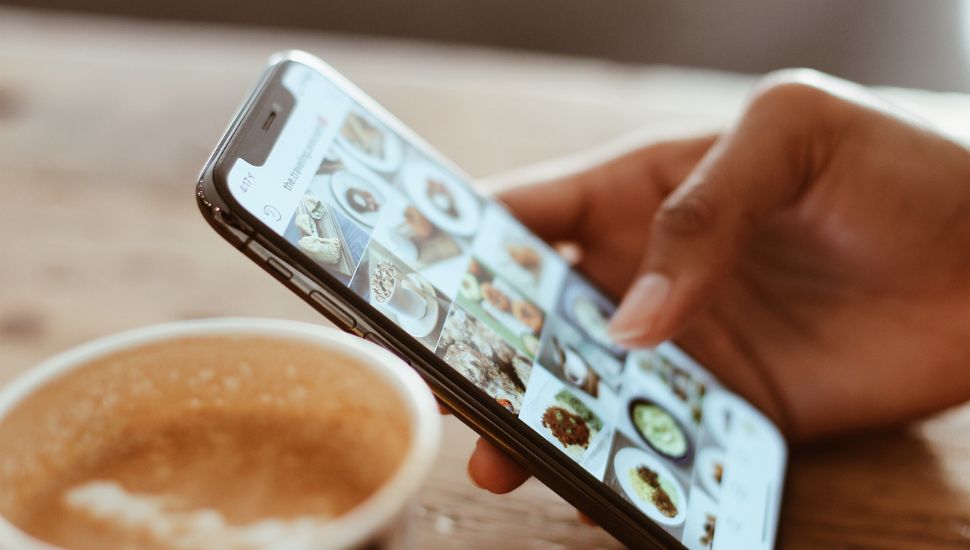 closeup of an iphone while browsing social media